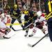 Michigan junior right wingman Luke Moffatt crashes the net and tries to score in the game against Miami on Saturday, March 23. Daniel Brenner I AnnArbor.com